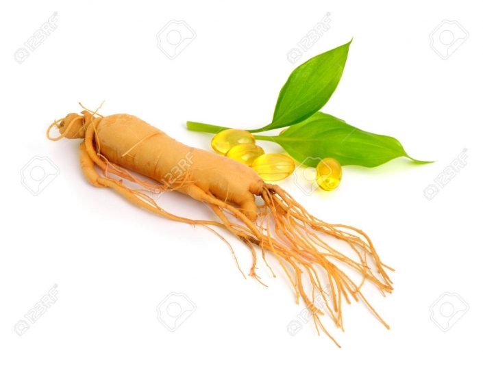 Ginseng root with pills and leawes. Isolated.
